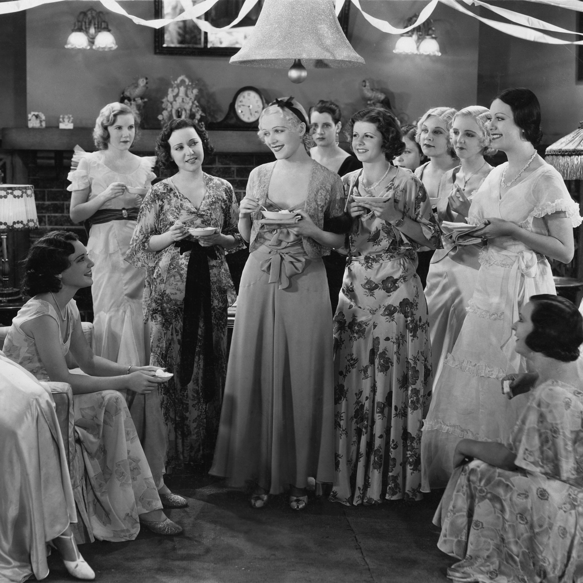 vintage photo of group holding tea cups and saucers